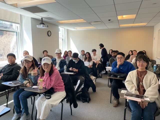 Students smile for the camera following PR agency founder's visit to NYU marketing class.